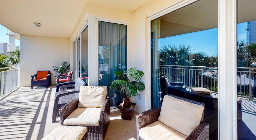 a living room with two couches and a patio, Sterling Shores 201 Destin (Condo) in Destin (FL)
