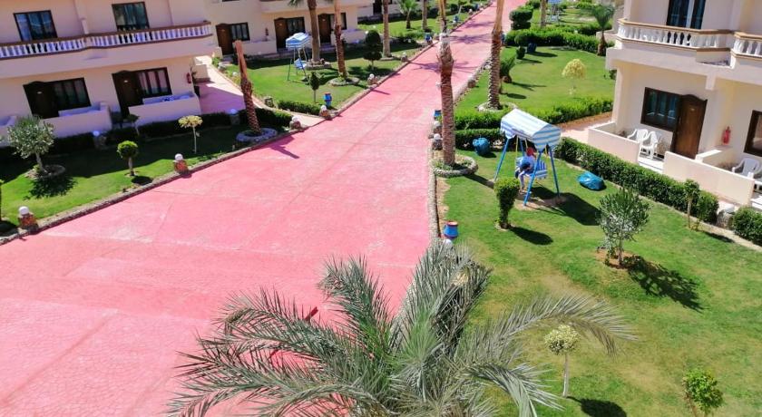 a large building with a lot of green grass, Bella Rose Nefertiti in Hurghada