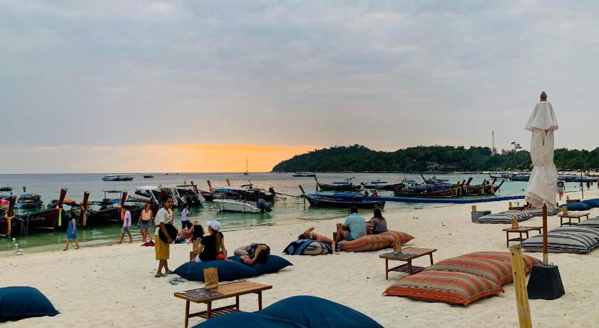 a beach filled with lots of people and umbrellas, Ananya Lipe Resort (SHA Extra Plus) in Ko Lipe