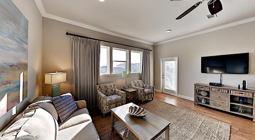 a living room filled with furniture and a large window, Alerio Condos in Destin (FL)