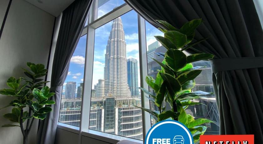 a window with a view of a city, Sky Suites KLCC by GENESIS in Kuala Lumpur