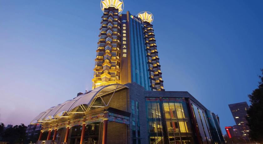 a large building with a clock on top of it, Grand Metropark Hotel Beijing in Beijing