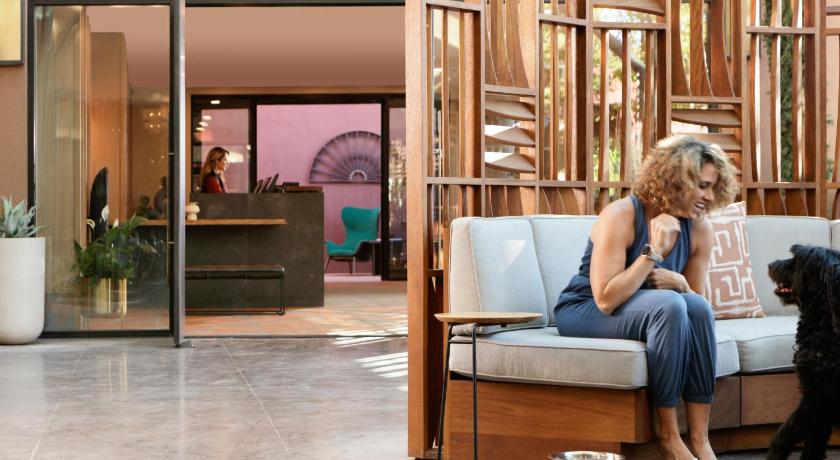 a woman sitting on a couch in a store, The Wilde Resort and Spa in Sedona (AZ)