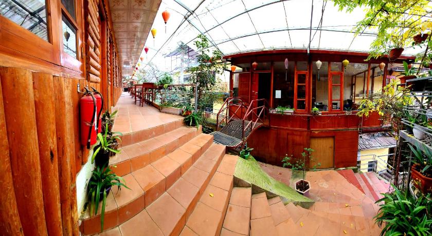 a building with a staircase leading to a patio area, Dang Khoa Garden Inn in Sapa
