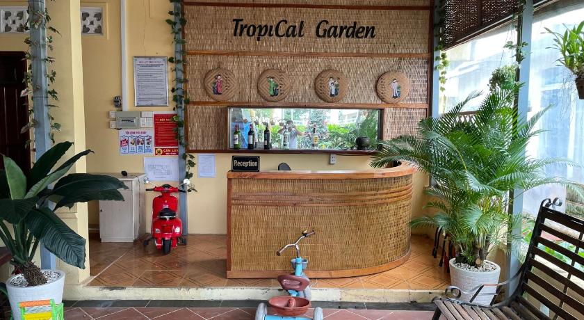 a wooden bench sitting in front of a store, Tropical Garden Phu Quoc in Phu Quoc Island