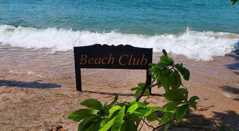 a sign on a beach near a body of water, Beach Club Koh Tao in Ko Tao