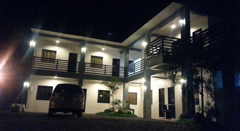a large white house with a large window, Dolyn Suites in General Santos City