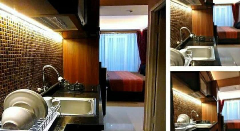 a bathroom with a sink and a toilet, Apartement Grand Asia Afrika Bandung by House Of Tofi in Bandung