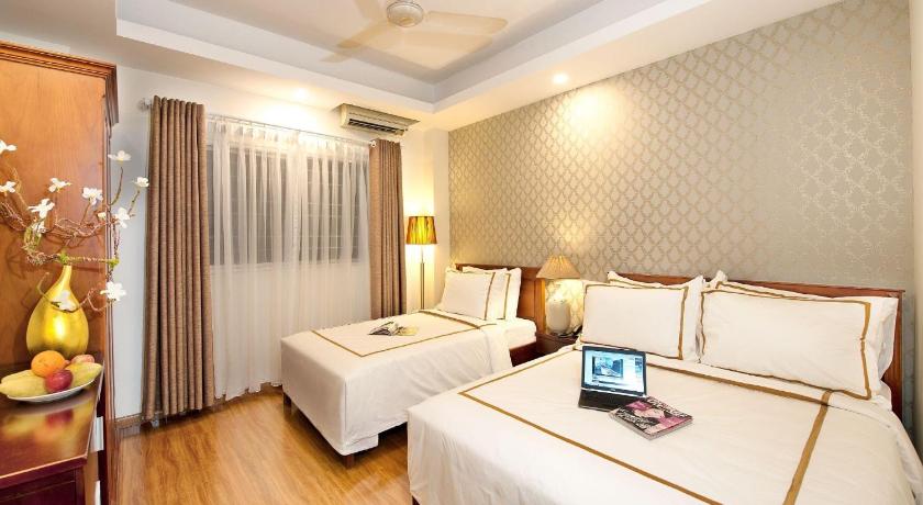 a hotel room with a bed and a desk, Lan Anh Hotel in Ho Chi Minh City