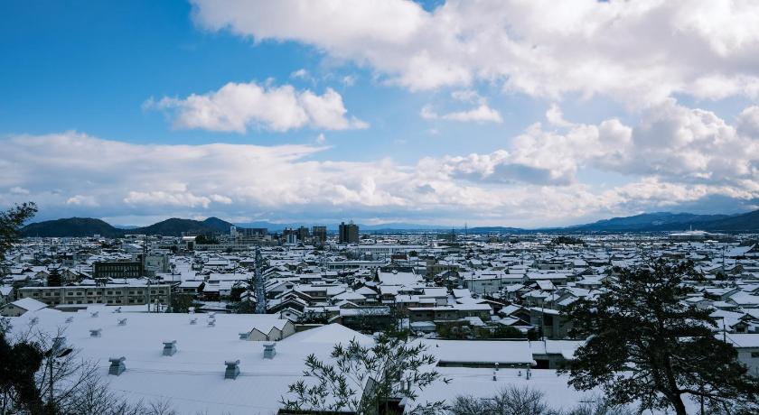 a snowy landscape with a mountain range, 薬水君近江八幡水郷民泊貸し切り in Omihachiman