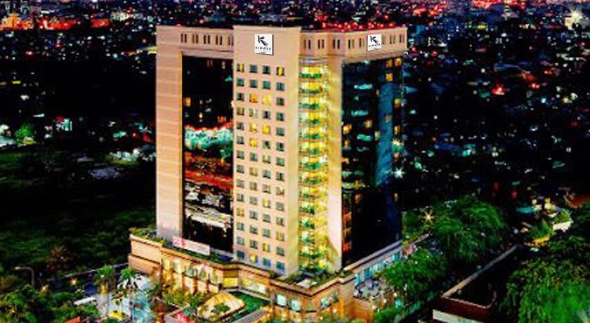 a large building with a clock on top of it, Kimaya Slipi Jakarta by Harris in Jakarta