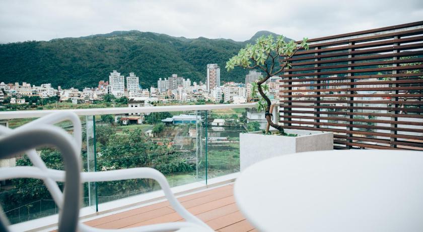 a view from a balcony overlooking a city, Onsense Villa in Yilan