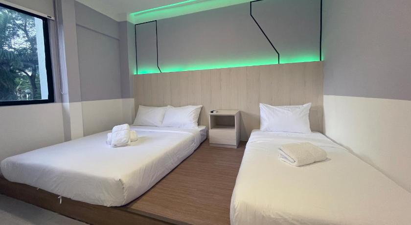 a hotel room with two beds and two lamps, GG Hotel Bandar Sunway in Kuala Lumpur