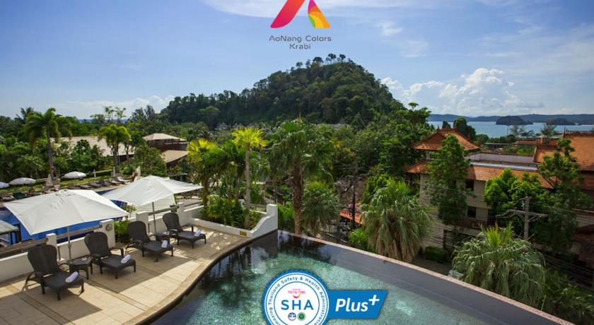 a swimming pool with a blue sky and palm trees, AoNang Colors Hotel Krabi Aonang Beach (SHA Extra Plus) in Krabi