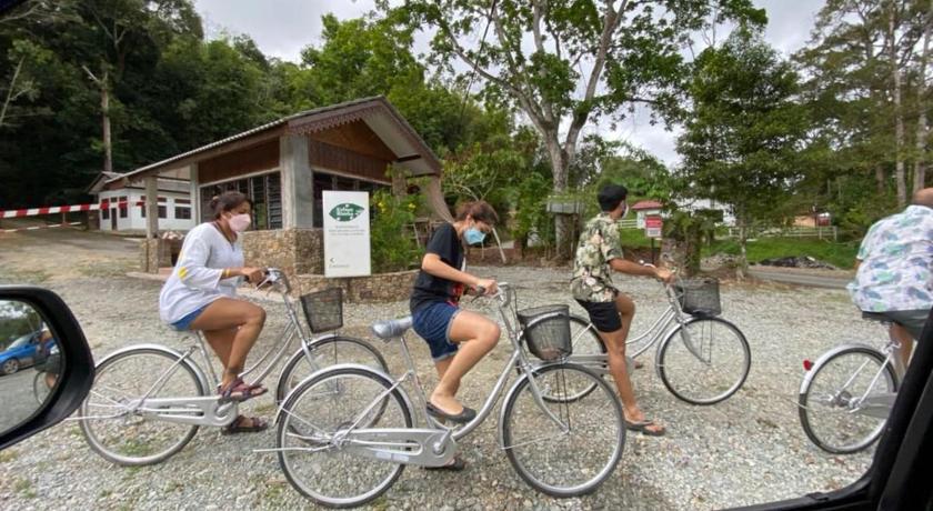 people riding bikes in a parking lot, Canopy Villa Tampik Valley in Bentong