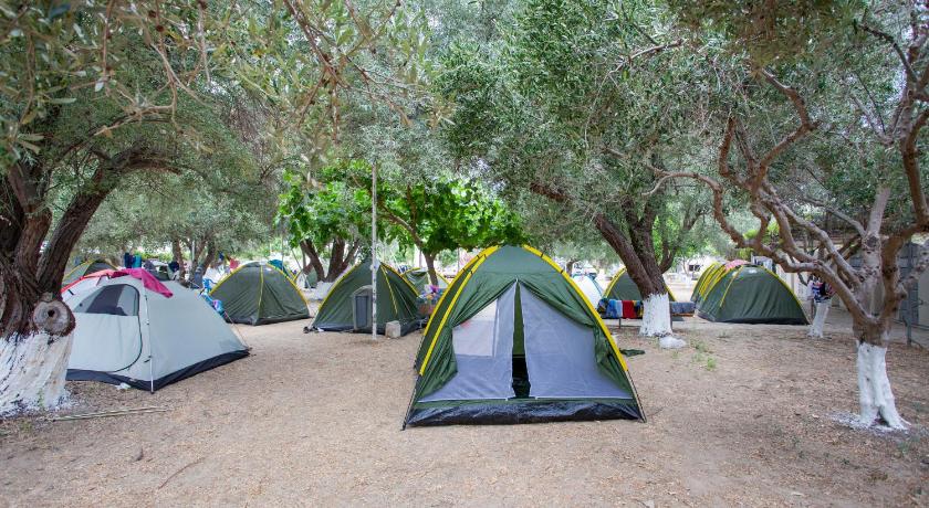 a tent is set up in the middle of a field, Camping Koula in Paros Island