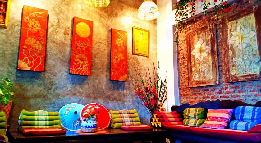 a living room filled with lots of colorful furniture, Sofa Gallery Hotel in Nong Khai