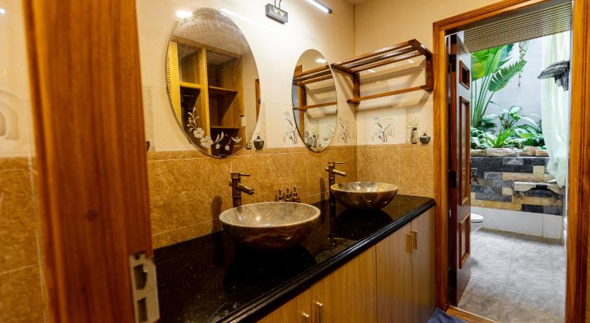 a bathroom with a sink and a mirror, Sea Night Hotel in Phan Thiet