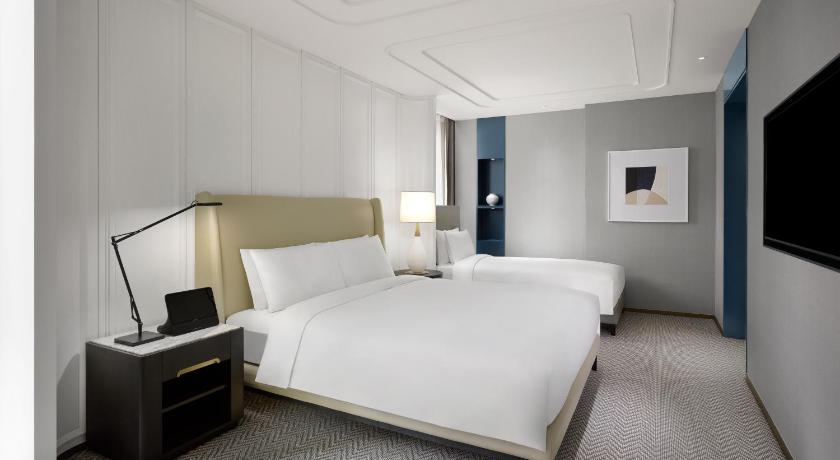 Image of Luxury Family Room with 1 King and 1 Single Size Beds 1