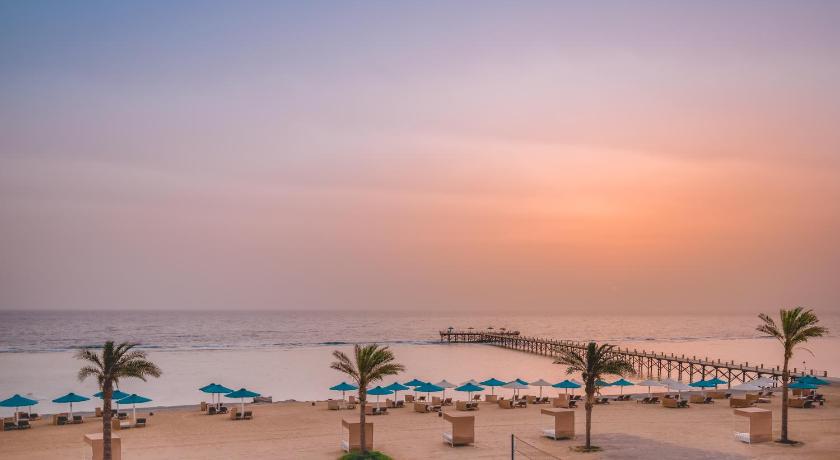 a beach filled with palm trees and palm trees, Albatros Sea World Marsa Alam in El Quseir