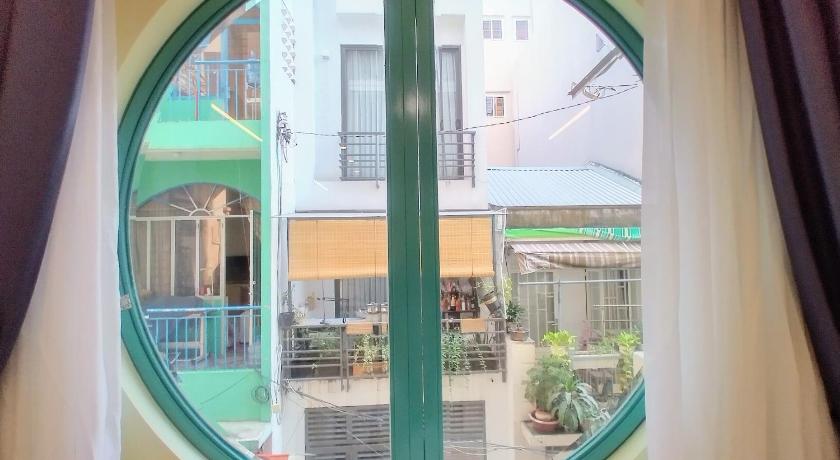 a reflection of a building in a mirror, Cozrum Homes Delightful Corner in Ho Chi Minh City