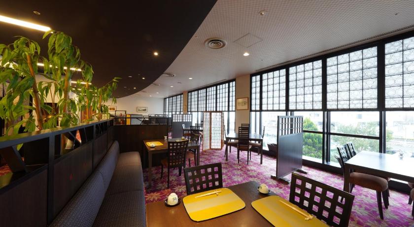 a living room filled with tables and chairs, Kitabiwako Hotel Grazie in Nagahama