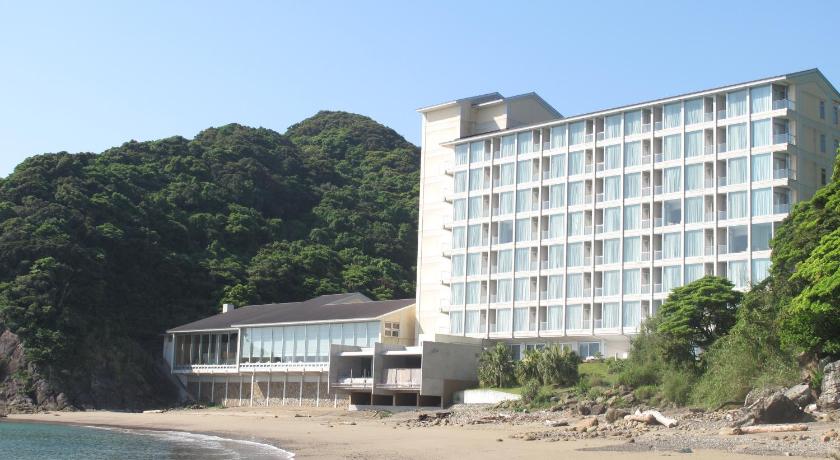 a hotel room with a large white building, Nichinankaigan Nango Prince Hotel in Nichinan