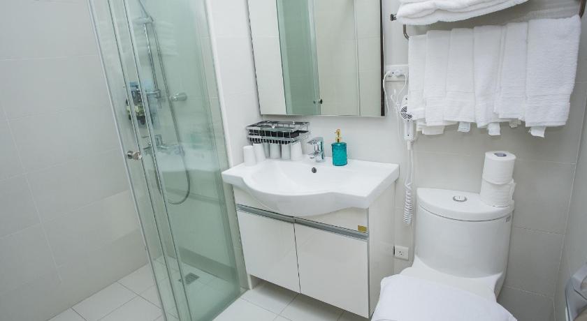 Image of 3-Bedroom Deluxe Suite with King Bed, 4 Single Beds and Balcony 12