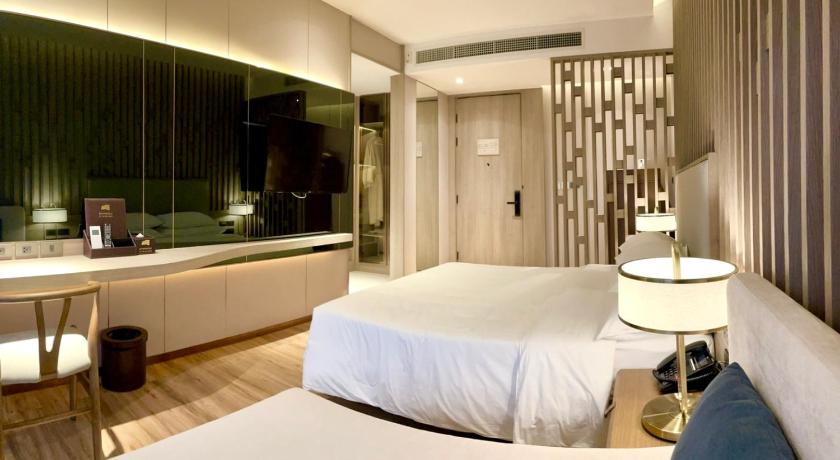 a hotel room with a large bed and a large window, Symphony of The Sea Hotel in Chonburi