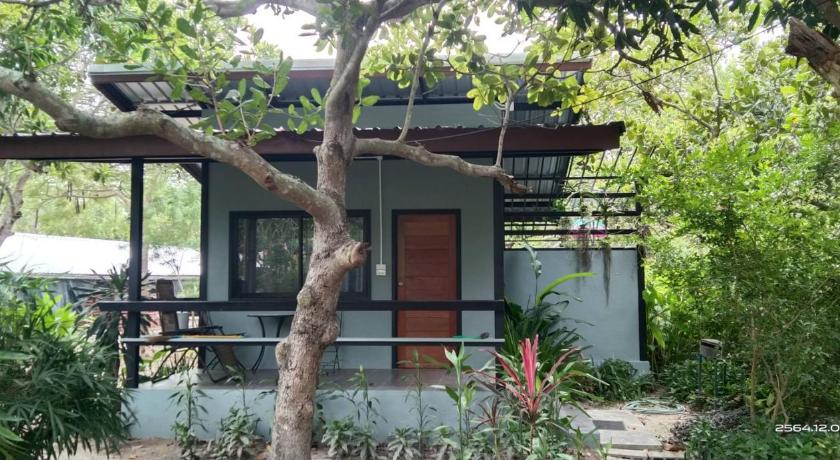 a house with a fence and a tree, Farm Madame Fleur in Hua Hin / Cha-am