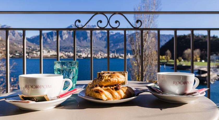 a plate of food on a table with a cup of coffee, LUXURY SUITES ROCOPOM - Lake Front in Valmadrera
