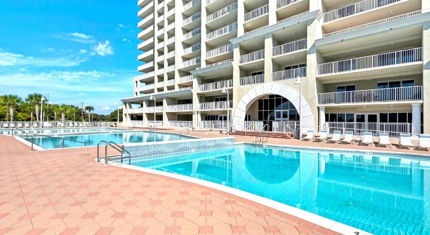 a large swimming pool in front of a large building, Ariel Dunes II 1601 in Destin (FL)