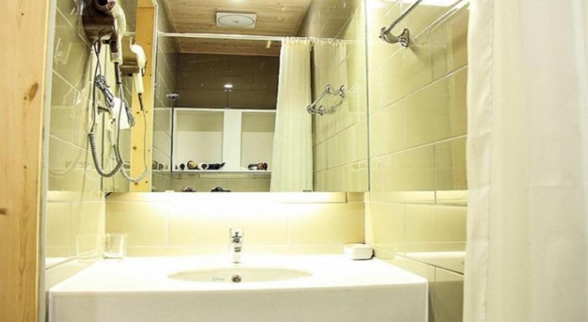 a bathroom with a sink and a mirror, Mirvill Pension Jeju in Jeju