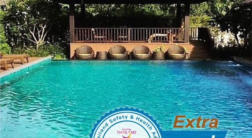 a blue and white swimming pool next to a lake, Pan Kled Villa Eco Hill Resort (SHA Extra Plus) in Chiang Rai