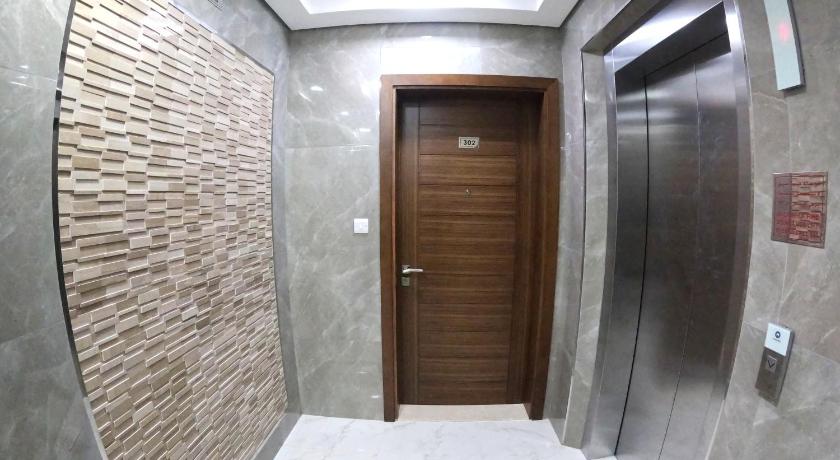 a bathroom with a walk in shower and a walk in shower stall, Karama Star Residence (Home Stay) in Dubai