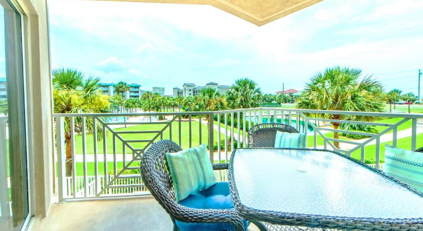 a patio area with a patio table and chairs, Amalfi Coast 209A in Destin (FL)