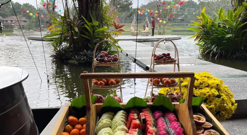 a basket filled with fruits and vegetables on a dock, Flamingo Happy Villa Owner in Phuc Yen