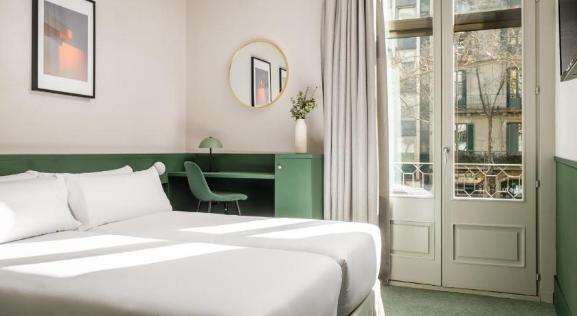 a bedroom with a bed and a dresser, Mothern by Pillow                                                                          in Barcelona