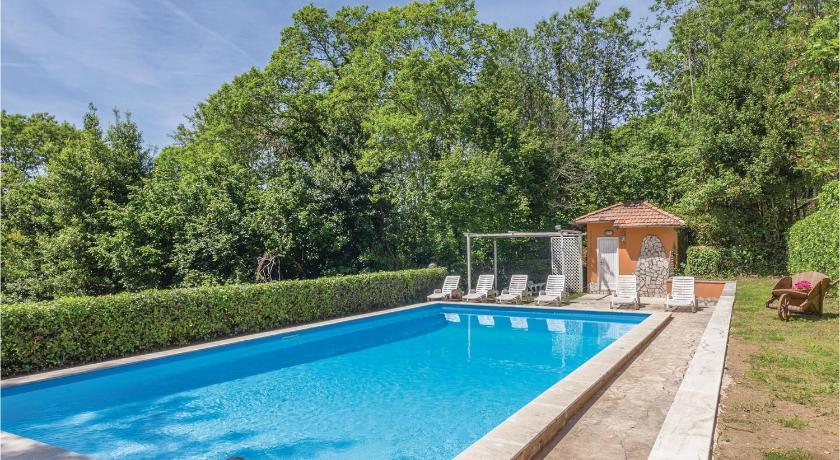 a pool with a pool table and chairs in it, Villa Castelli Romani in Nemi