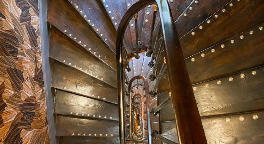 a stairway leading up to a staircase with a clock on it, Hotel Astrid in Paris