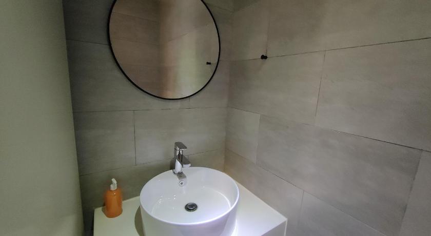a bathroom with a sink and a mirror, AWESOMESTAY at ARTE MONT KIARA in Kuala Lumpur