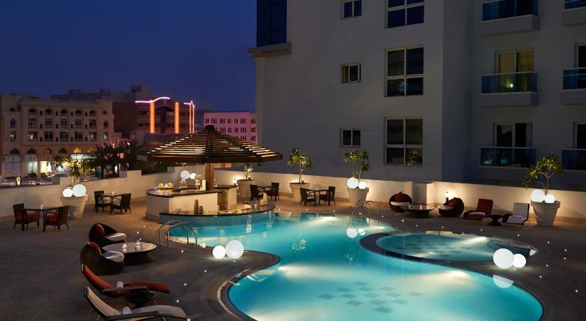 a large swimming pool in a large building, Hyatt Place Residences Al Rigga in Dubai