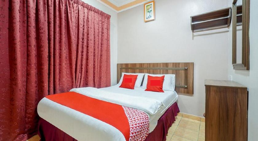 a hotel room with a large bed and a large window, Hill Times Inn Hotel in Ipoh