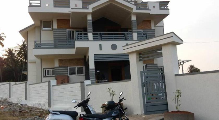 a motorcycle parked in front of a house, DWARAKA STAY INN-Rejoicing Family Home Coorg in Coorg