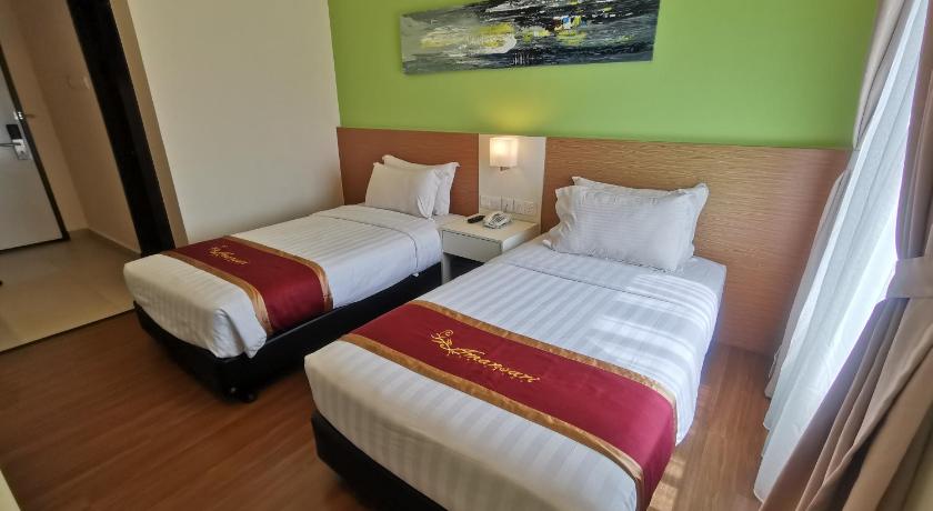 a hotel room with two beds and two lamps, Amansari Hotel Desaru in Desaru