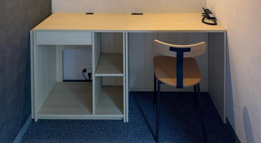 a small room with a desk and a chair, Akabane Holic Hotel in Tokyo