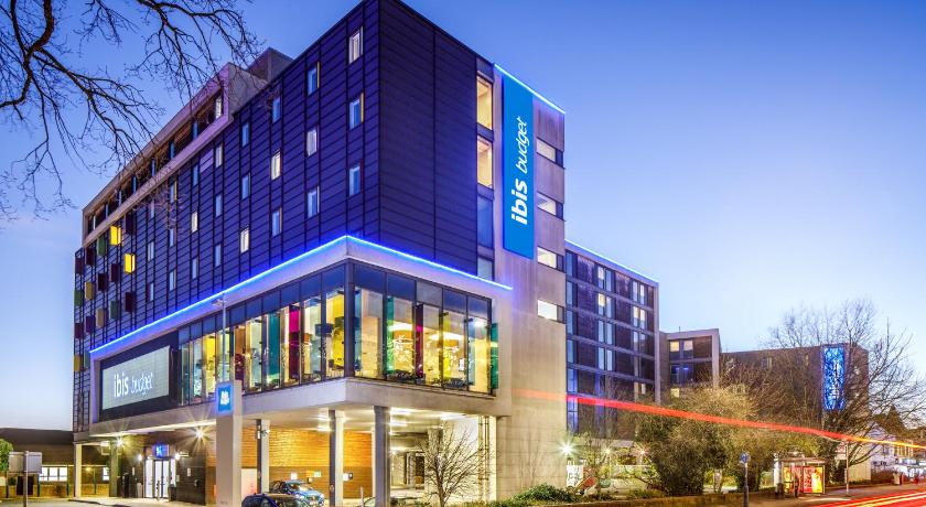 a large building with a clock on the side of it, ibis budget London Heathrow Central in London