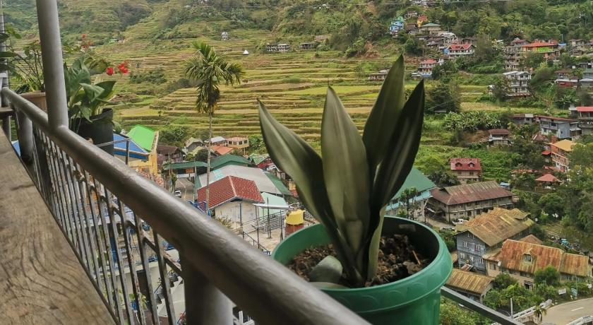 a view from a balcony of a building with a view of a river, 7th Heaven Lodge and Cafe in Banaue