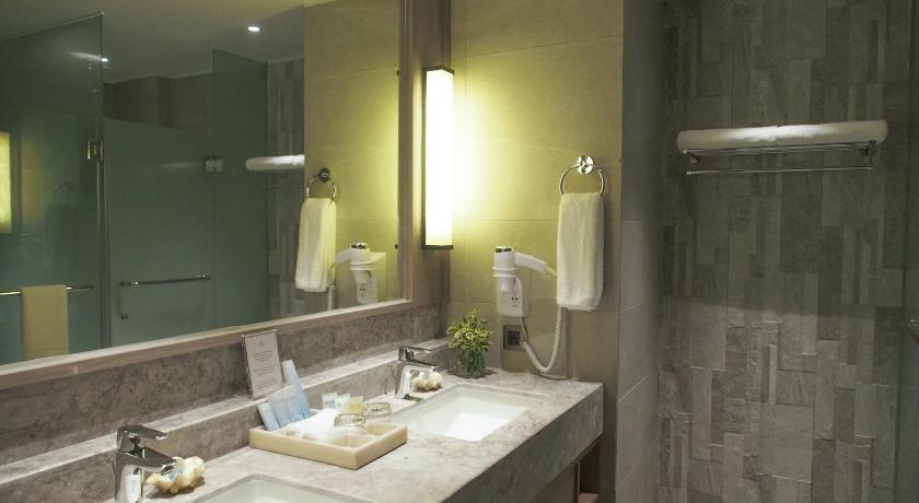 a bathroom with two sinks and a mirror, Henann Park Resort in Boracay Island