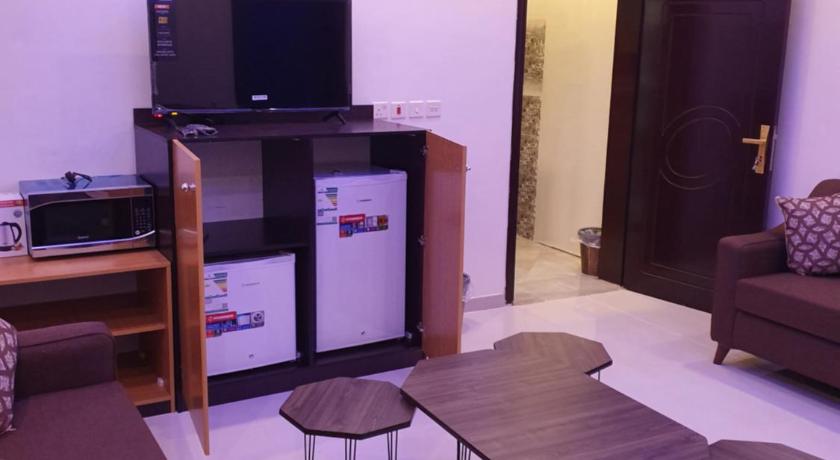 a living room filled with furniture and a tv, للعوائل فقط Al Shadi Apartments 2 in Yanbu
